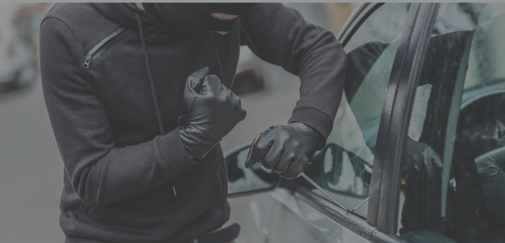 Breaking into car - Effective Car Theft Prevention Strategies - FR-44 Insurance