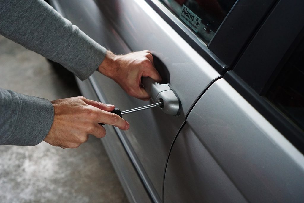 Breaking into car - Effective Car Theft Prevention Strategies - FR-44 Insurance